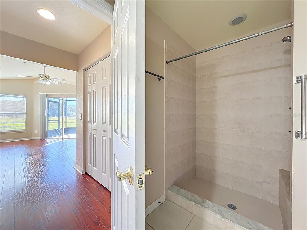100 Silver Sea Road Winter Springs, FL 32708 - Photo 28 of 44 a view of a hallway with wooden floor and a bathroom