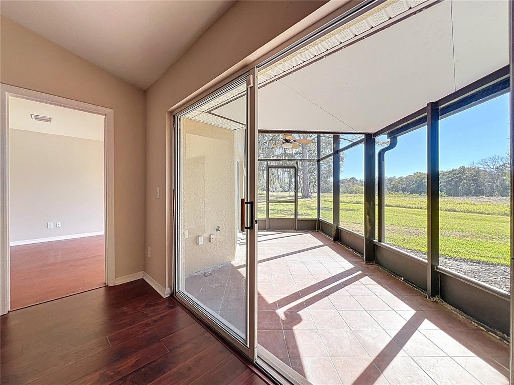 100 Silver Sea Road Winter Springs, FL 32708 - Photo 35 of 44 a view of front door and porch with wooden floor