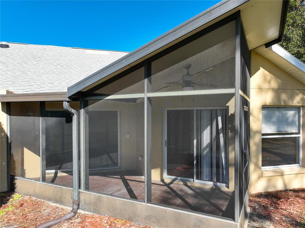 100 Silver Sea Road Winter Springs, FL 32708 - Photo 36 of 44 a patio with table and chairs