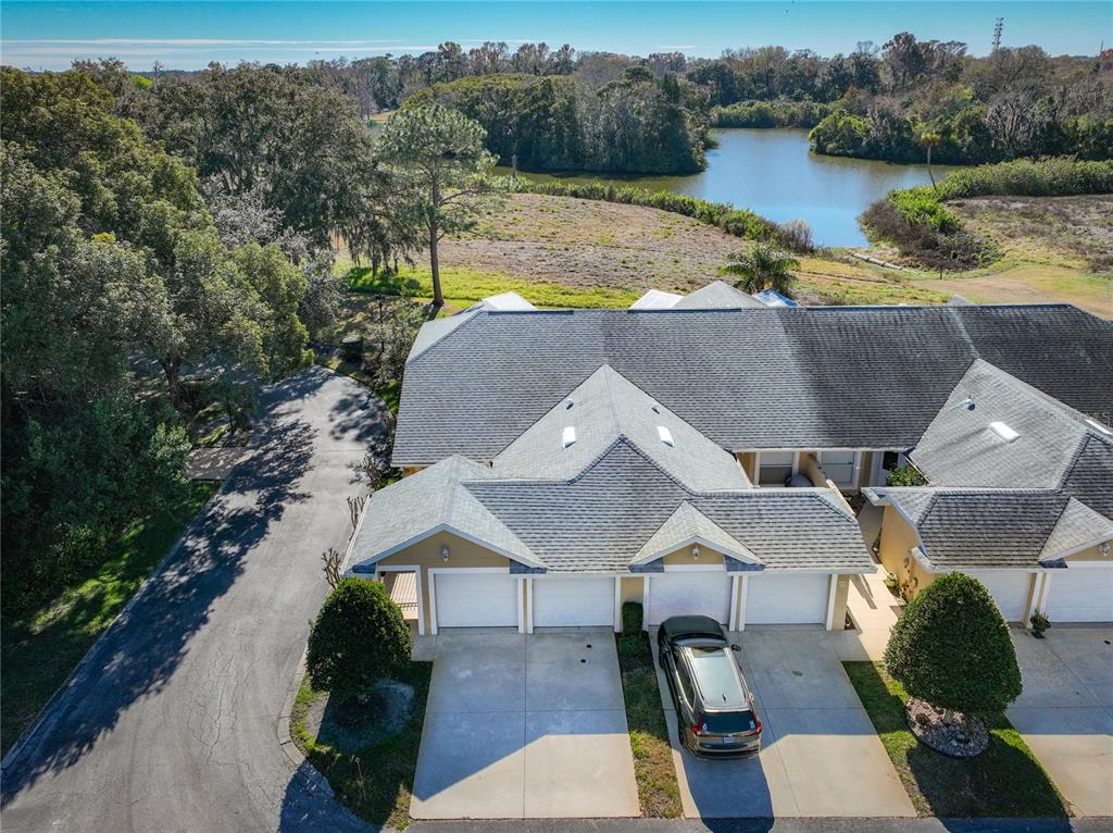 100 Silver Sea Road Winter Springs, FL 32708 - Photo 41 of 44 an aerial view of a house with pool lake view and mountain view