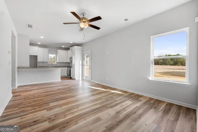 a view of a kitchen with a dishwasher and a window