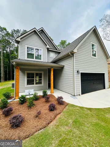 a front view of a house with yard