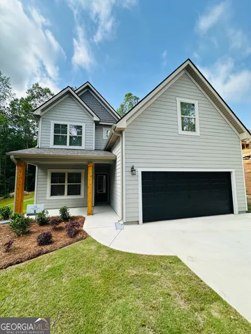 a front view of a house with garage