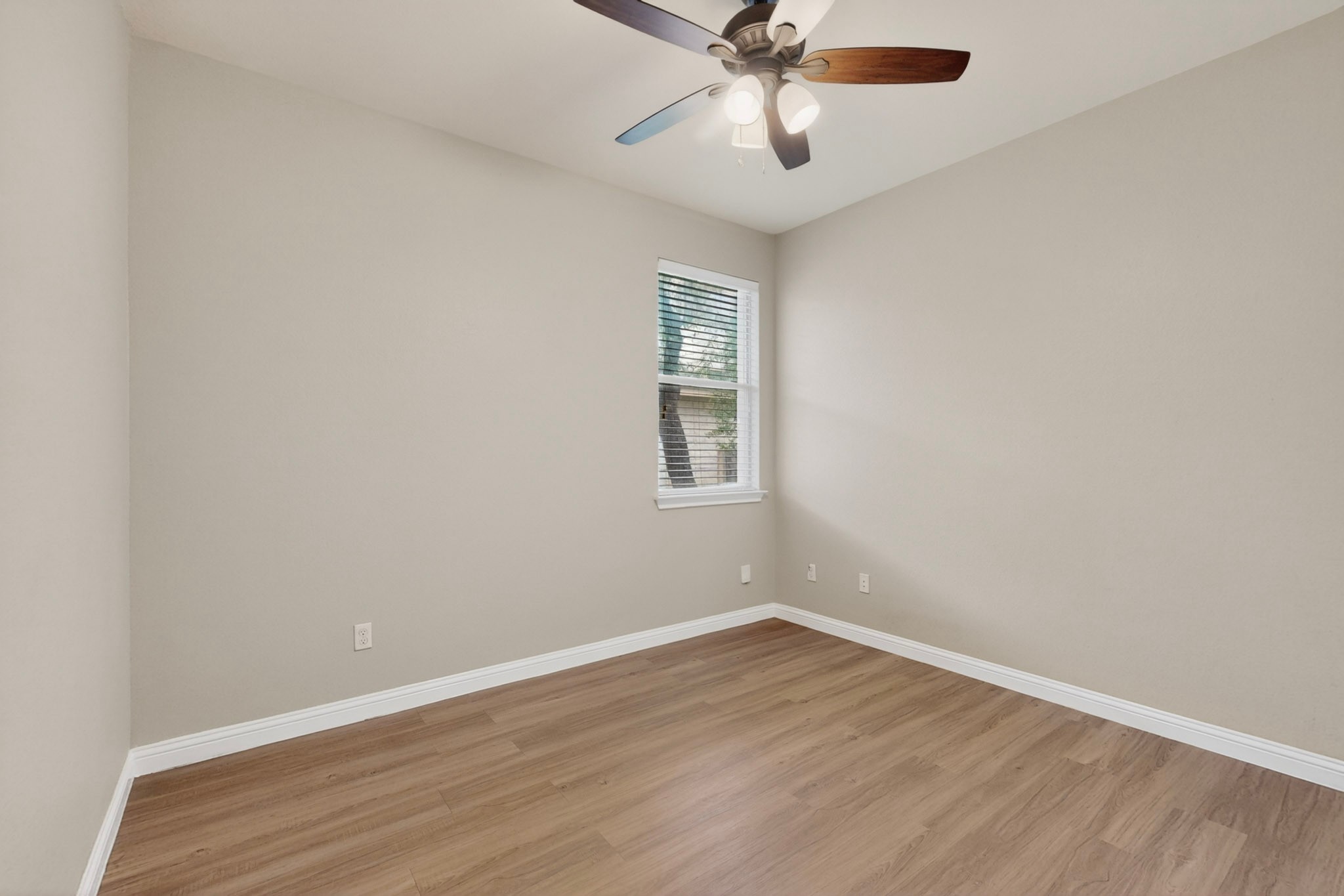 178 Limestone Trail Austin, TX 78737 - Photo 30 of 40 Room featuring wood-finish flooring, neutral wall paint, and white baseboards