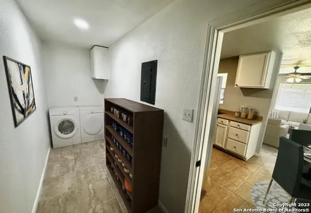 a kitchen with a refrigerator and a stove