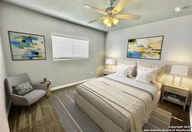 a bedroom with a bed and a couch