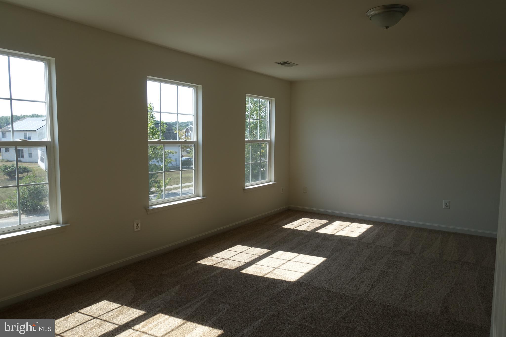 411 Robbins Farm Road Cambridge, MD 21613 - Photo 18 of 35 Master bedroom is huge with three large windows