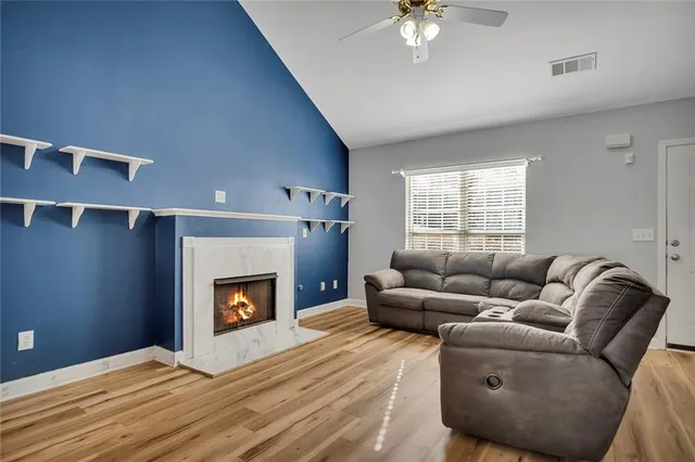 a living room with furniture and a fireplace