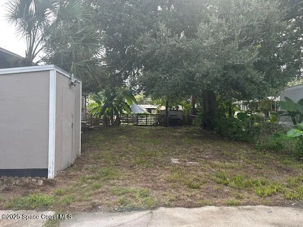 a view of a yard with an outdoor space