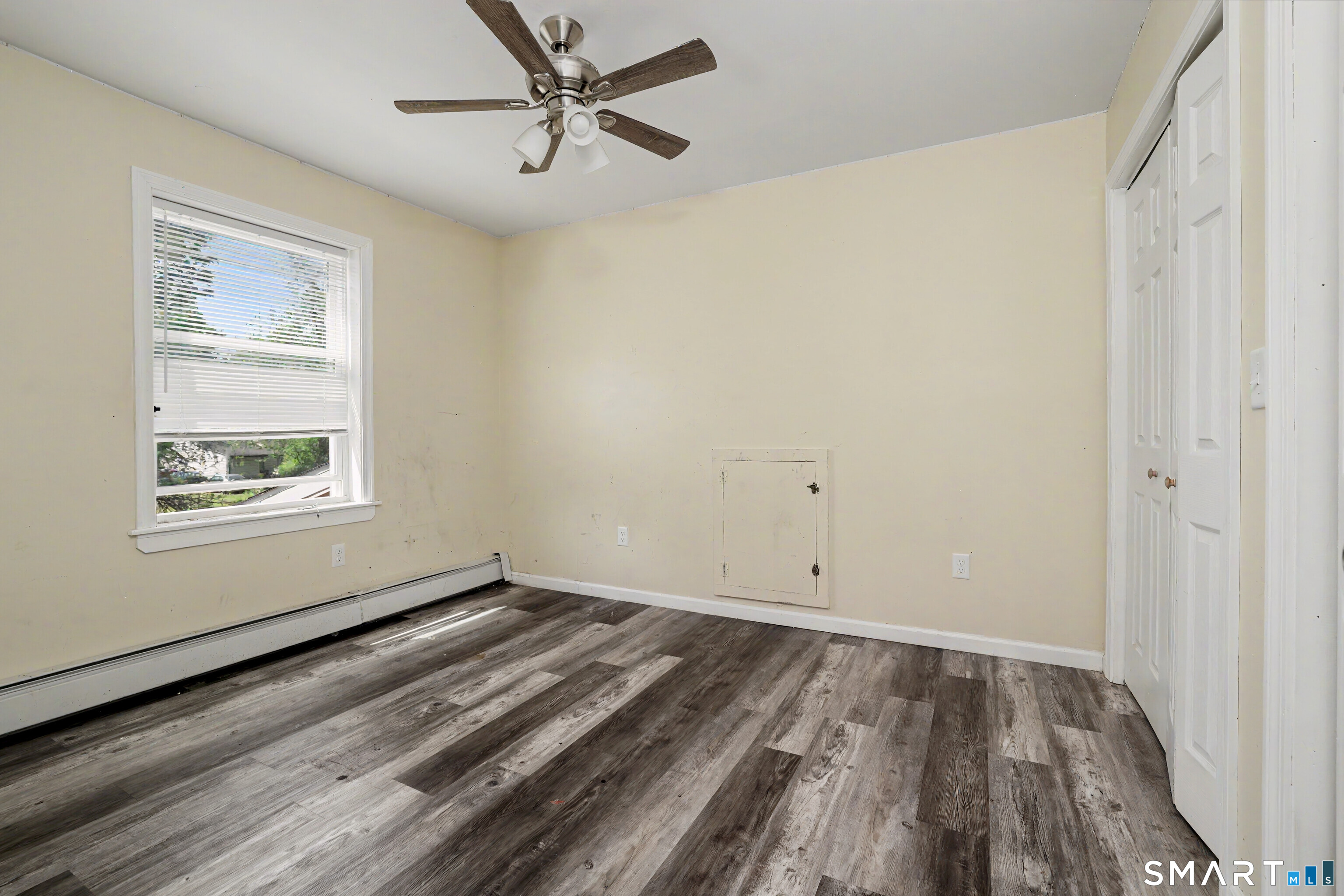 97 Boothbay Street Bloomfield, CT 06002 - Photo 27 of 33 a view of empty room with wooden floor and fan