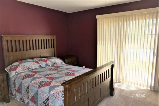 908 Randall Street Ridgecrest, CA 93555 - Photo 28 of 35 a bed sitting in a bedroom next to a window