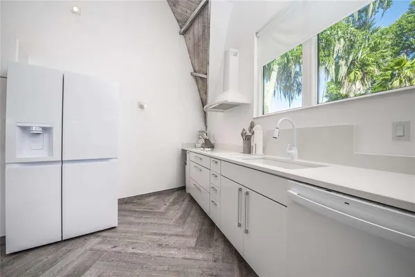 a view of a house with swimming pool and a yard