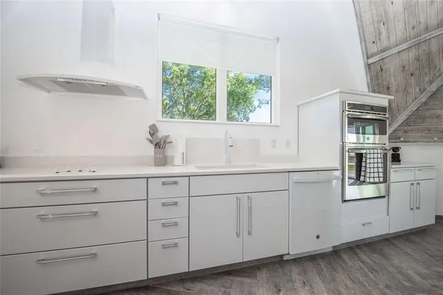 a view of a swimming pool with an outdoor space and seating area