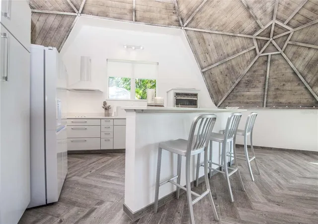 a view of swimming pool with seating space and city view