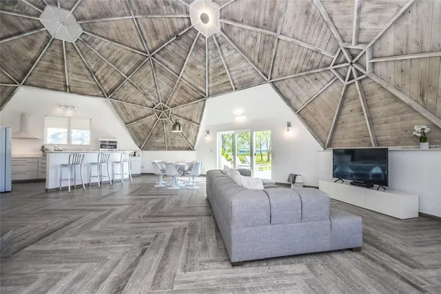 a dining room with furniture and wooden floor