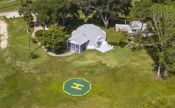 a aerial view of a house with a yard