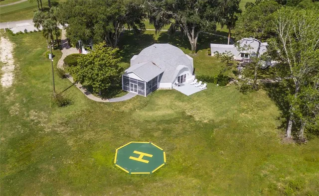 a aerial view of a house with a yard