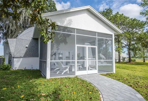 a bathroom with a sink a toilet a mirror and shower