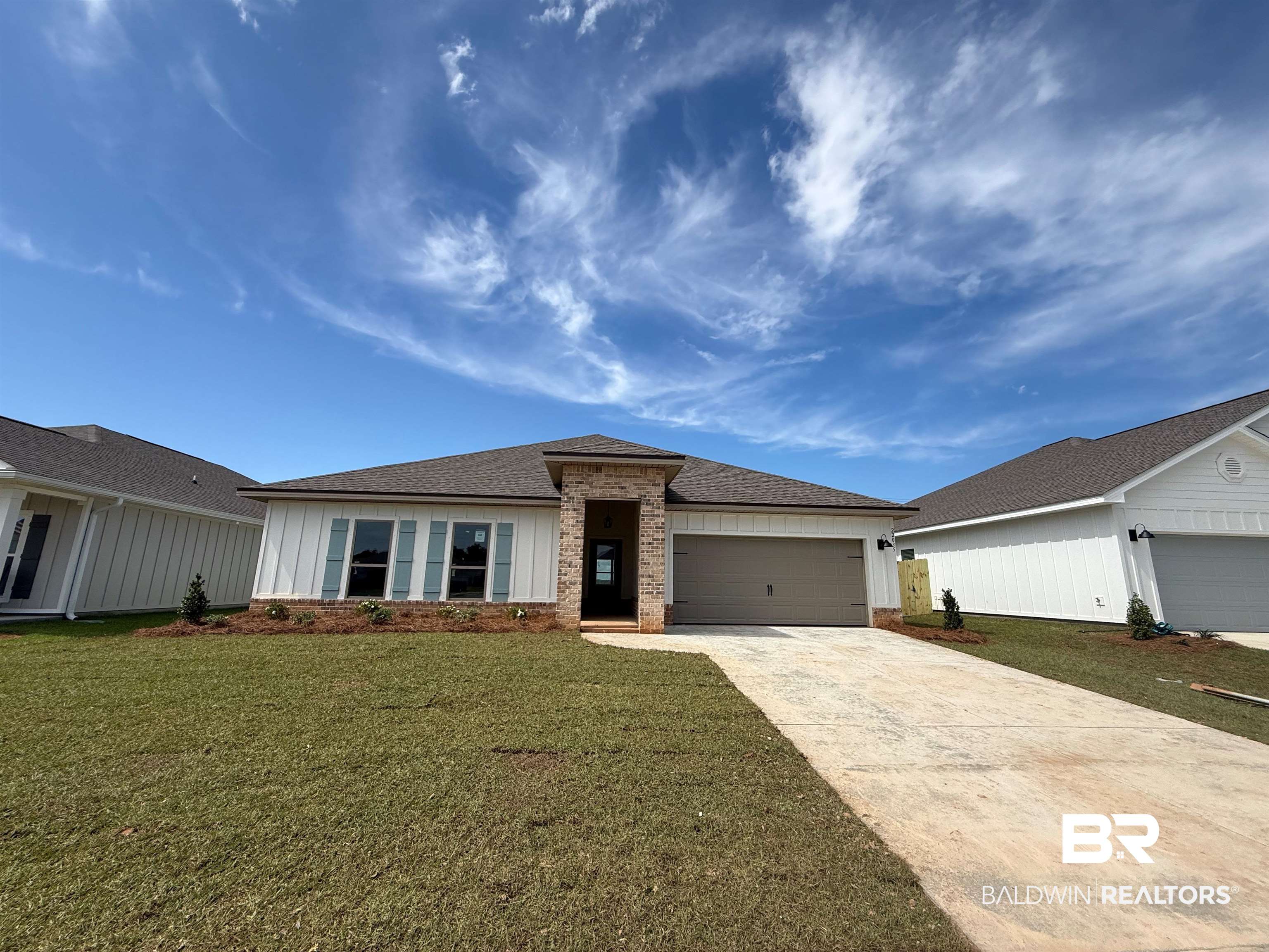 22035 Aleutian Avenue Foley, AL 36535 - Photo 1 of 66 Single-story residence featuring a brick and white board-and-batten exterior