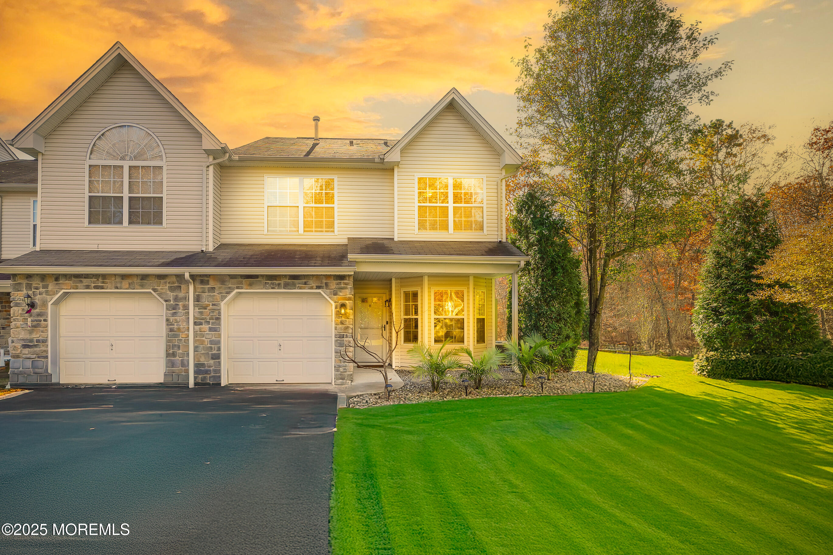 a front view of a house with garden