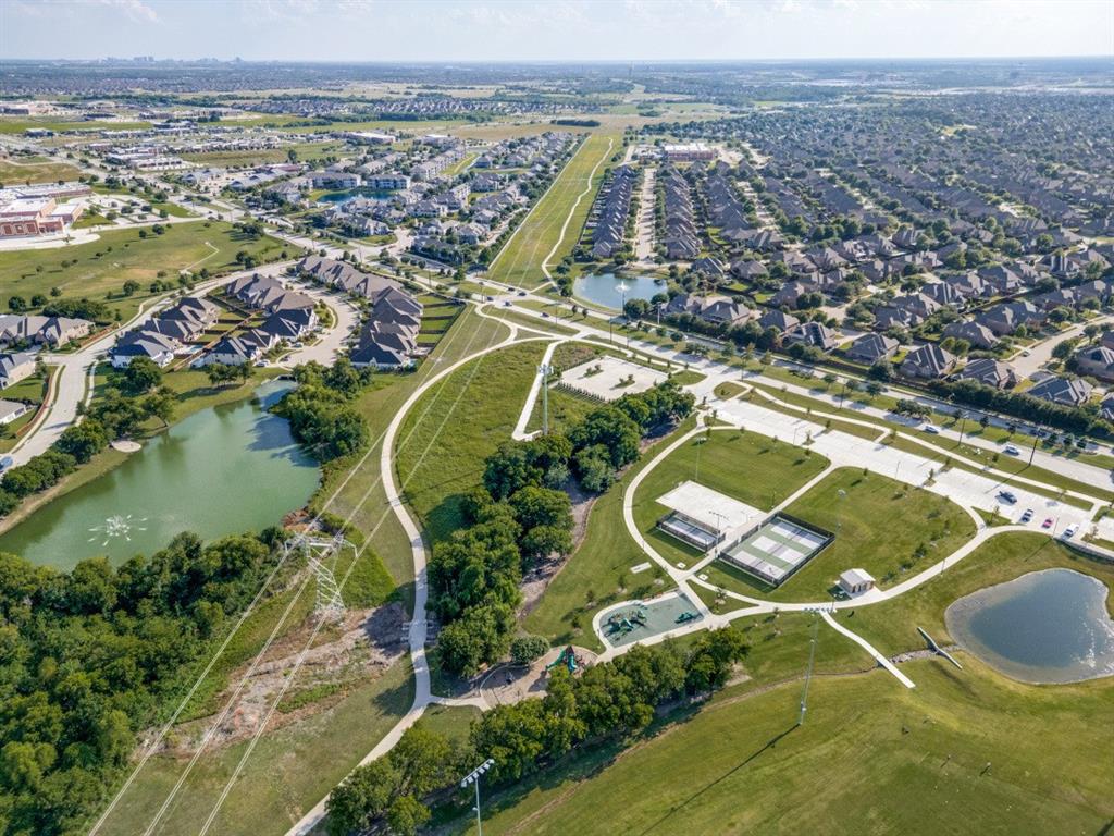 2721 Old Shire Path Road Prosper, TX 75078 - Photo 38 of 39 Aerial overview featuring multiple lakes, green spaces, walking paths, and recreational courts