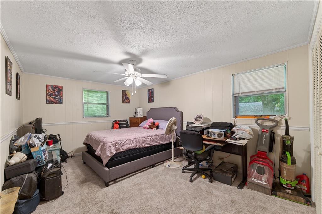 4399 Highway 411 Rydal, GA 30171 - Photo 13 of 37 a bedroom with bed and a large window