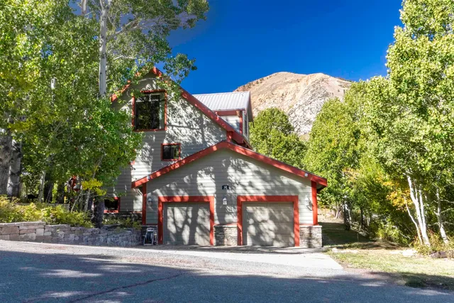 a view of a house with a tree