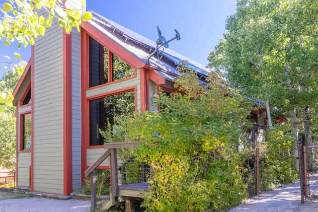 a view of a house with a tree