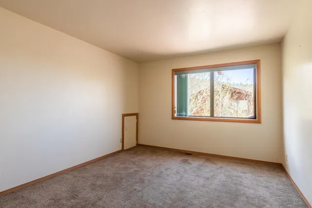 an empty room with closet area