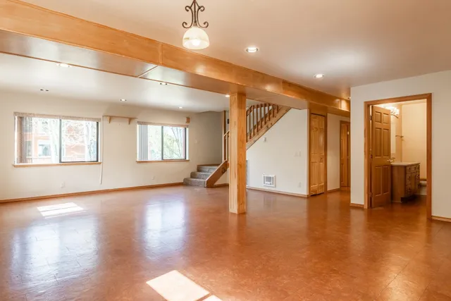 a view of a house with a tree in front of it