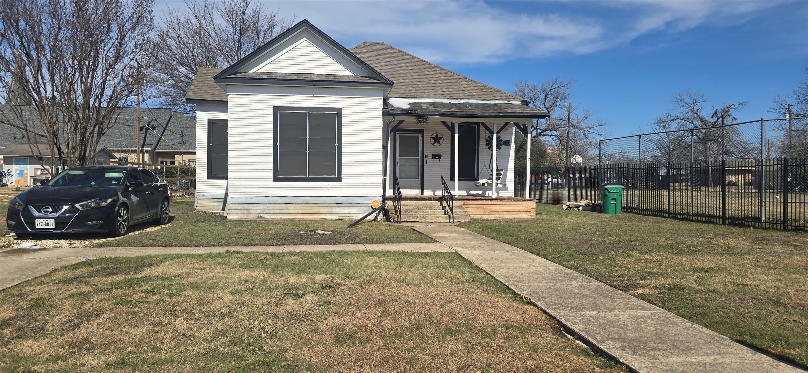 420 West 6th Street Taylor, TX 76574 - Photo 1 of 12 a front view of a house with a yard