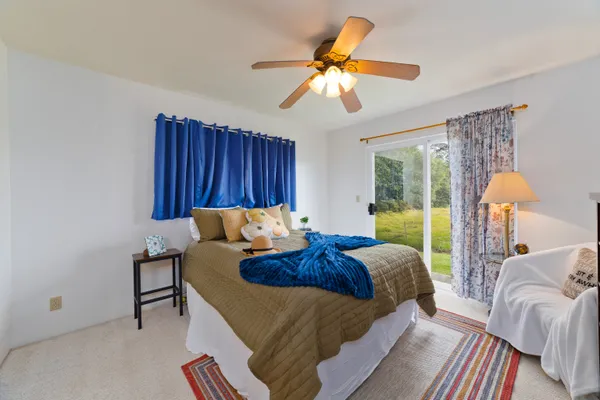 a bed room with a bed and a chandelier