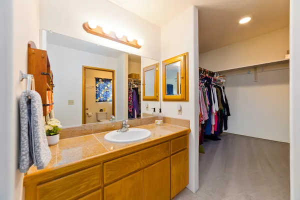 a bathroom with a sink double vanity and a mirror