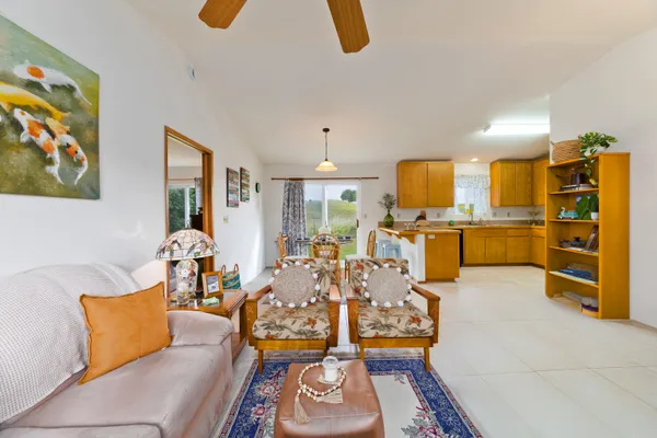 a living room with furniture fireplace and window