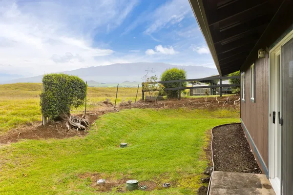 a view of a water fountain and a big yard