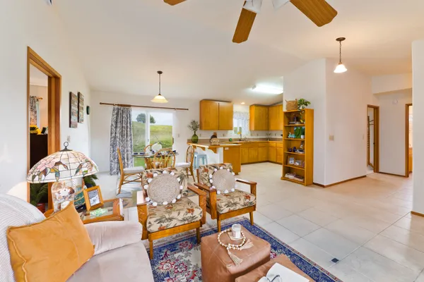 a view of a living room and kitchen
