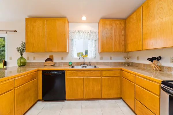 a kitchen with a sink and cabinets