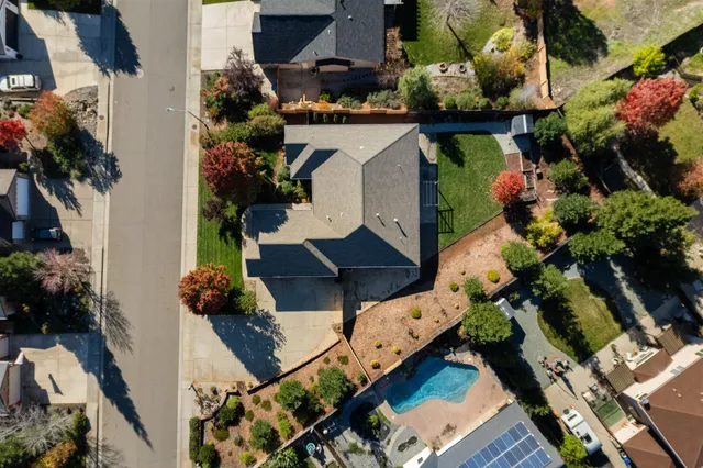 an aerial view of houses with yard