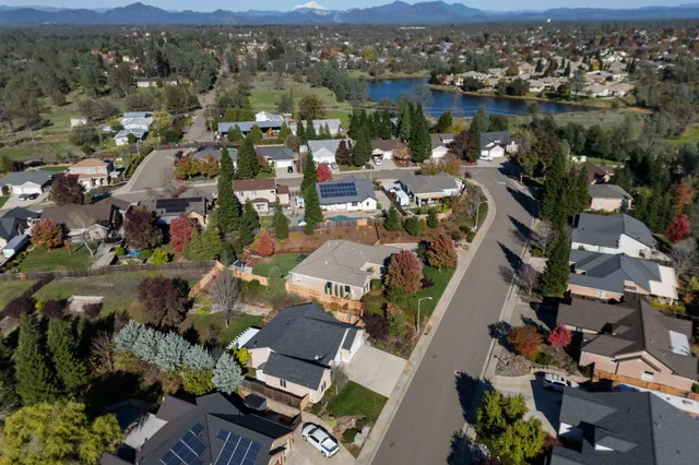 an aerial view of residential houses with outdoor space