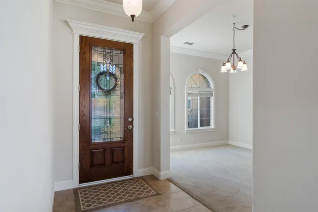 a view of livingroom with window and hallway