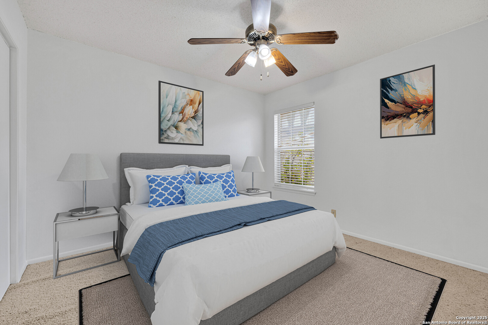 60 Oak Villa Road, Unit F3 Canyon Lake, TX 78133 - Photo 11 of 22 a bedroom with a large bed and a chandelier