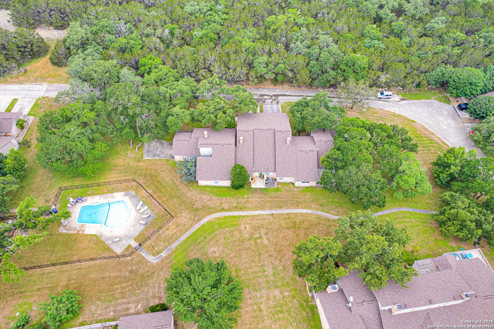 60 Oak Villa Road, Unit F3 Canyon Lake, TX 78133 - Photo 18 of 22 an aerial view of a house with a yard