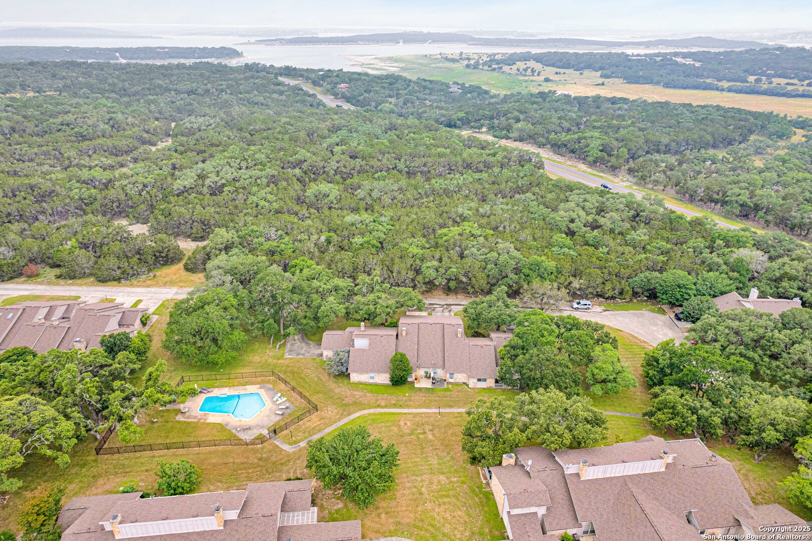 60 Oak Villa Road, Unit F3 Canyon Lake, TX 78133 - Photo 20 of 22 an aerial view of a house with a yard