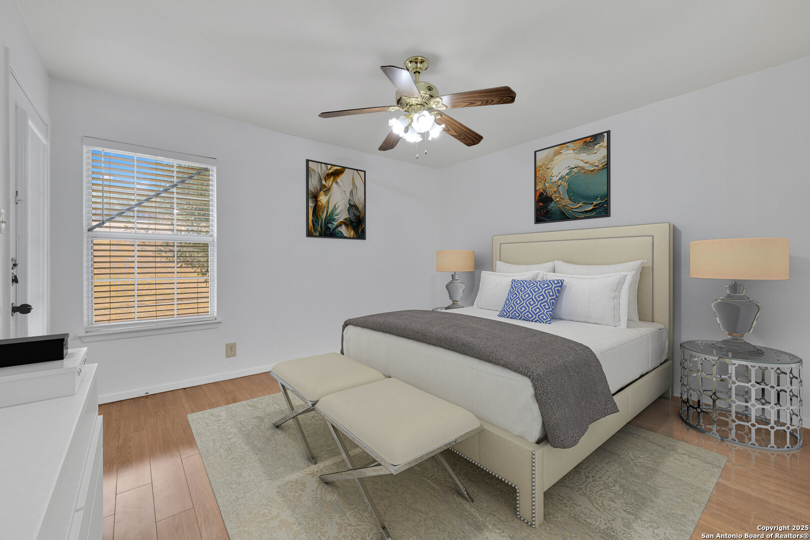 60 Oak Villa Road, Unit F3 Canyon Lake, TX 78133 - Photo 8 of 22 a bedroom with a bed and a chandelier