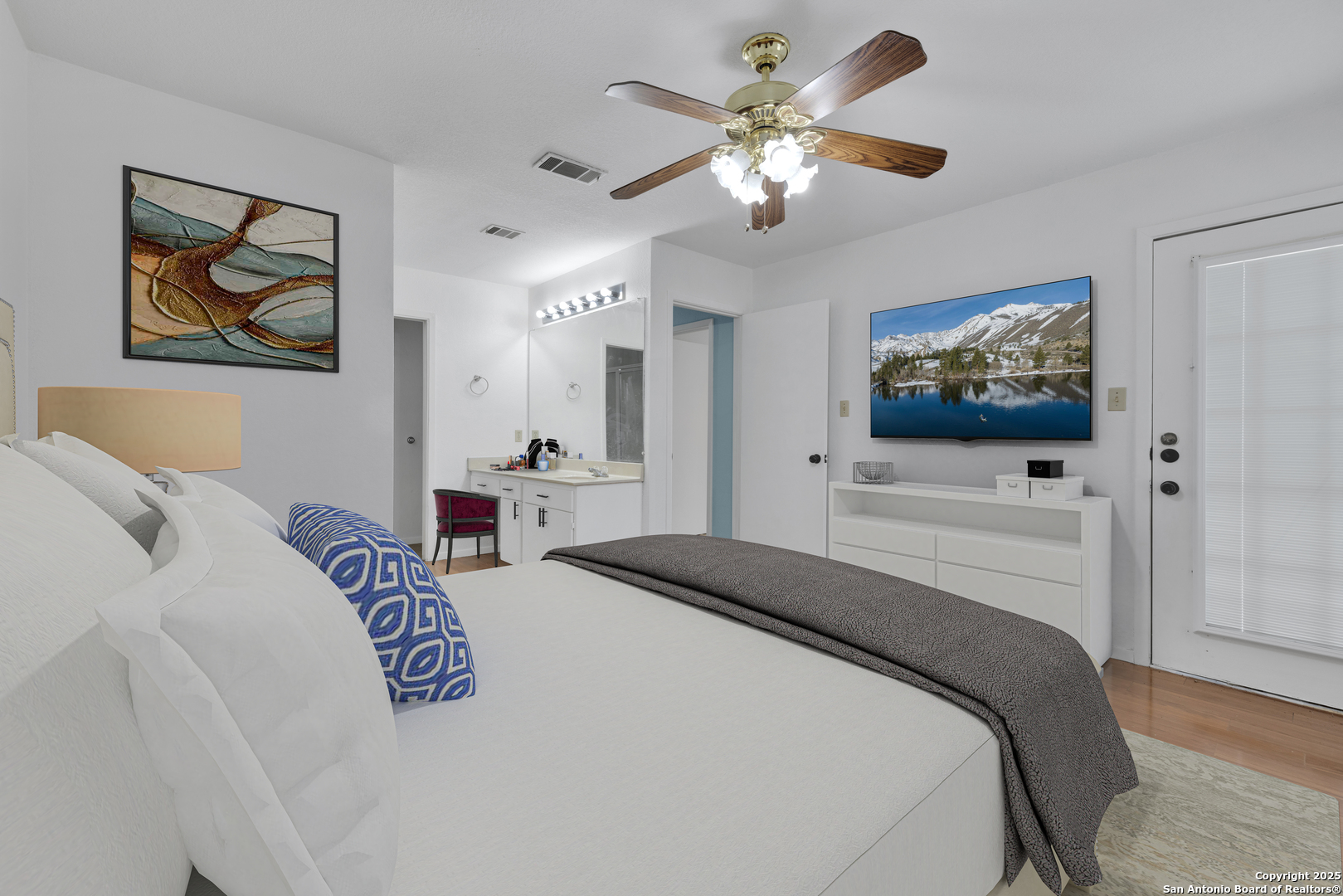 60 Oak Villa Road, Unit F3 Canyon Lake, TX 78133 - Photo 9 of 22 a bedroom with a large bed and a flat screen tv