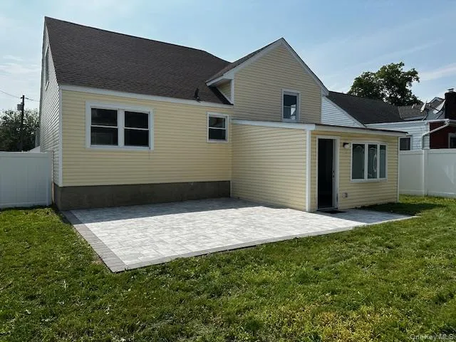 a house view with a backyard space