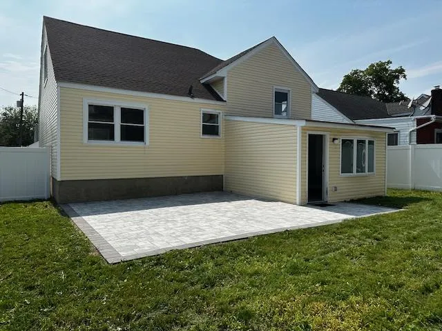 a house view with a backyard space