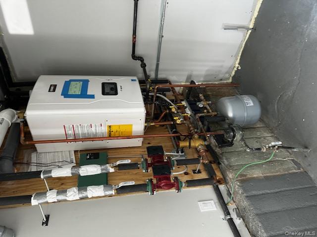558 Oxford Road Cedarhurst, NY 11516 - Photo 22 of 22 Utility room with water heater