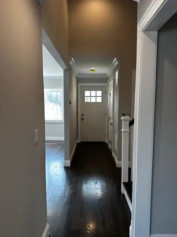 a view of gallery with wooden floor