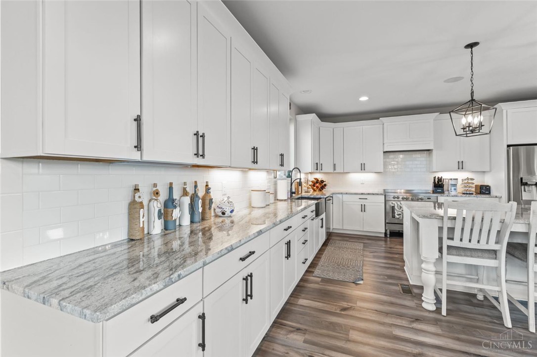 2425 Middleboro Road Clarksville, OH 45113 - Photo 44 of 91 Bright and airy, this kitchen features sleek white cabinetry and elegant marble countertops.